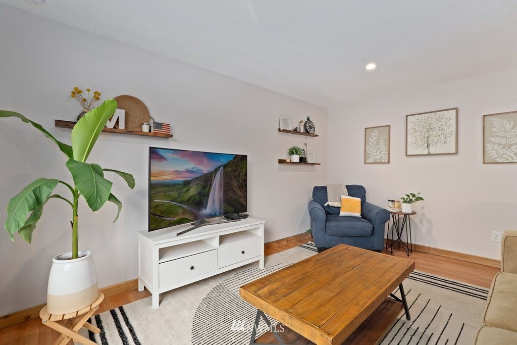 18216 19th Drive Southeast Bothell, WA 98012 - Photo 5 of 37 a living room with furniture and a flat screen tv