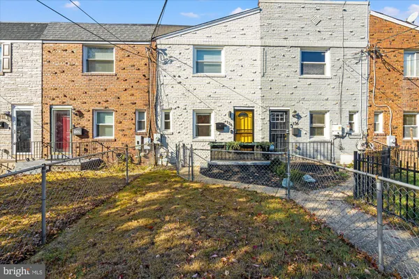 a view of a brick house with many windows