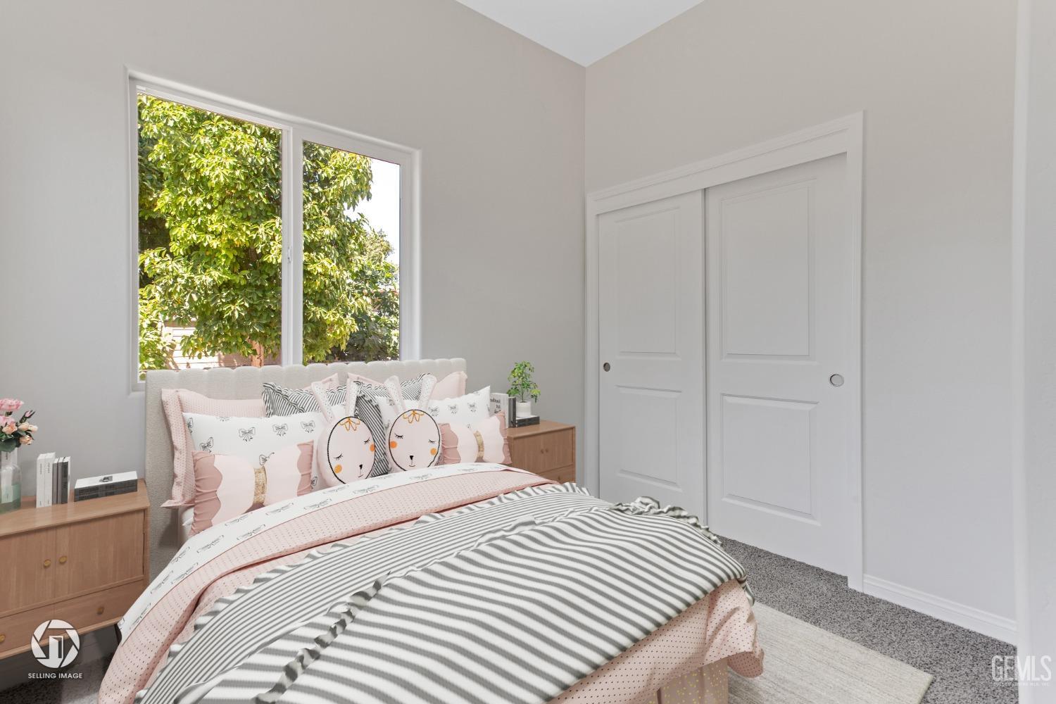 Undisclosed Address Bakersfield, CA 93305 - Photo 21 of 28 a bedroom with a bed and a window