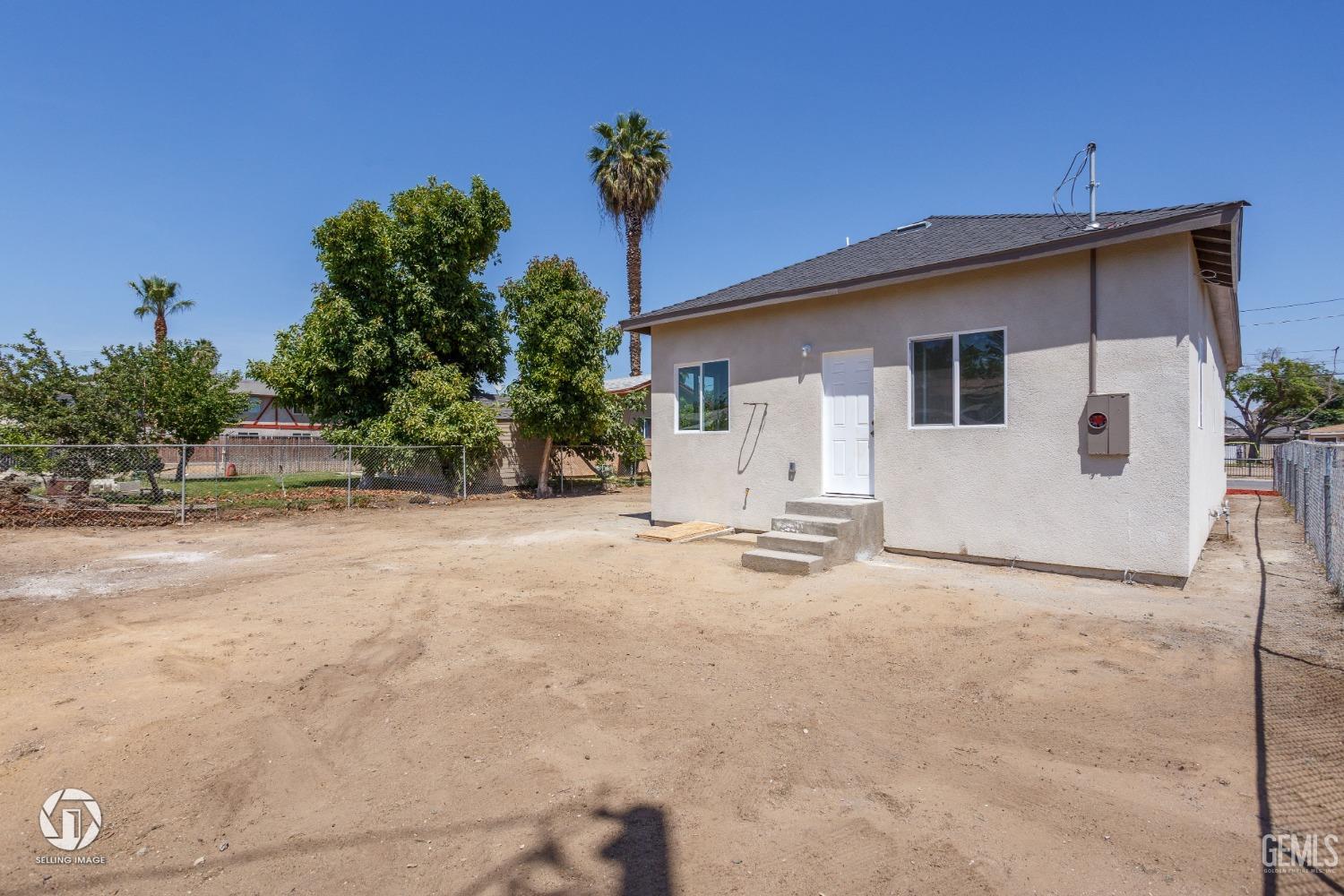 Undisclosed Address Bakersfield, CA 93305 - Photo 26 of 28 a view of a house with a backyard