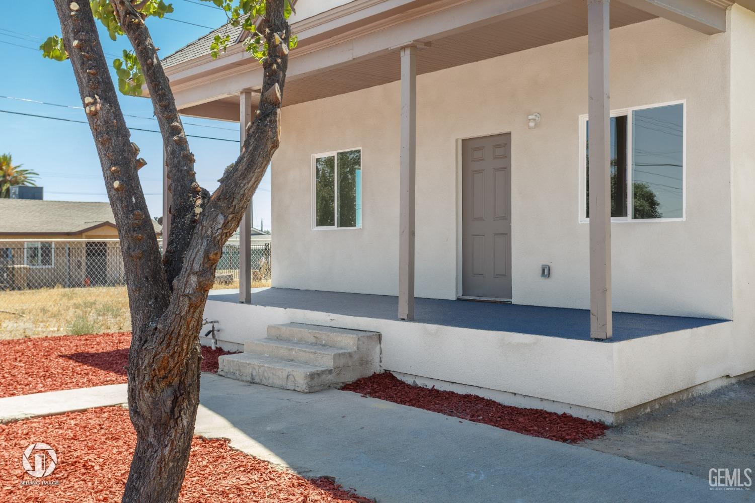 Undisclosed Address Bakersfield, CA 93305 - Photo 4 of 28 a front view of a house with entryway