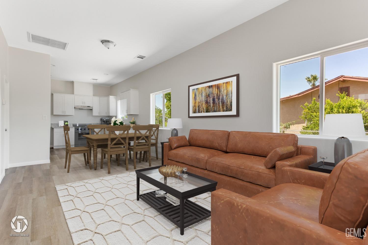 Undisclosed Address Bakersfield, CA 93305 - Photo 6 of 28 a living room with furniture a lamp and a window