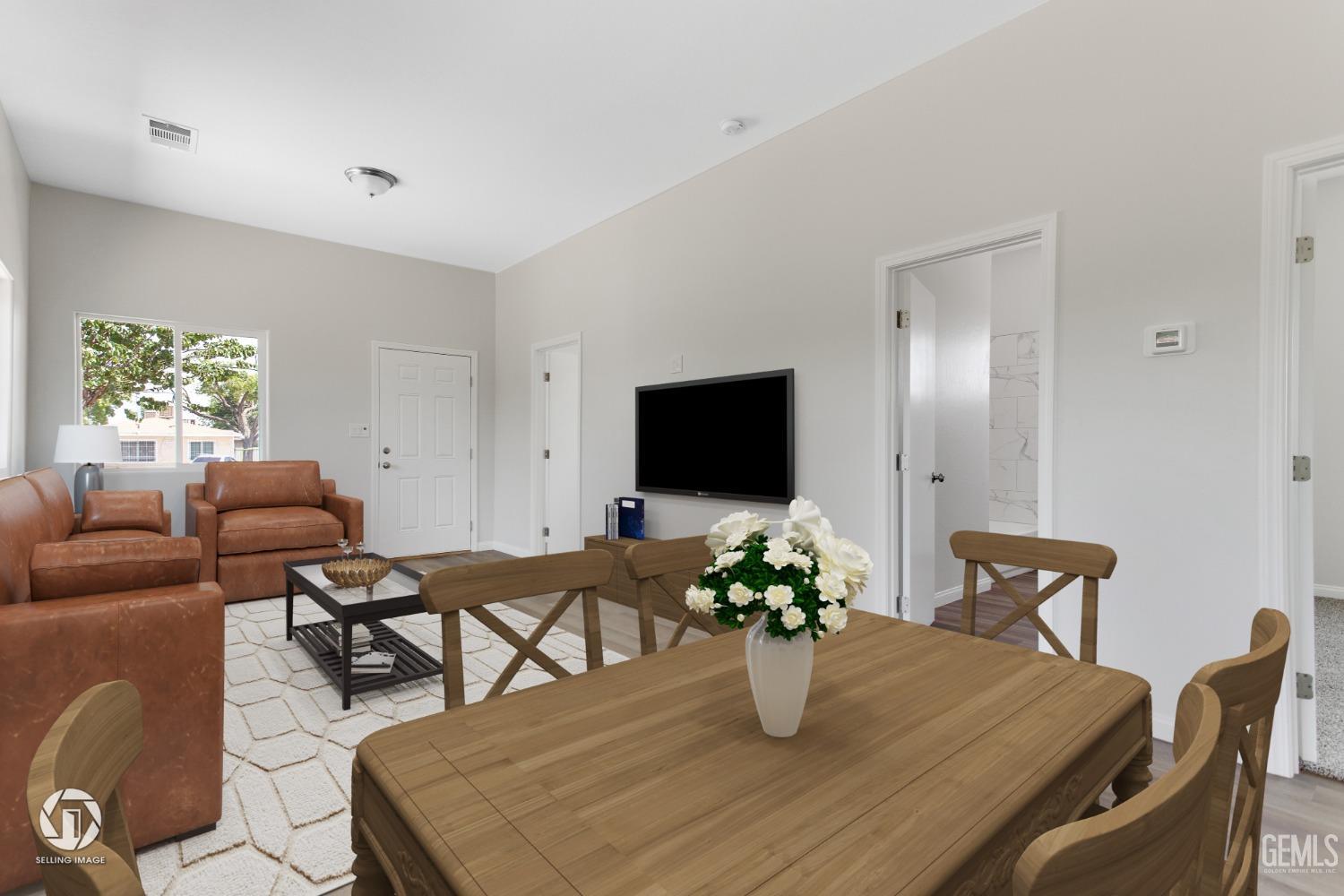 Undisclosed Address Bakersfield, CA 93305 - Photo 7 of 28 a living room with furniture potted plant and a flat screen tv