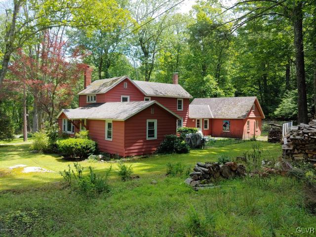 376 Sand Spring Road Cresco, PA 18326 - Photo 35 of 37 a front view of house with yard and green space