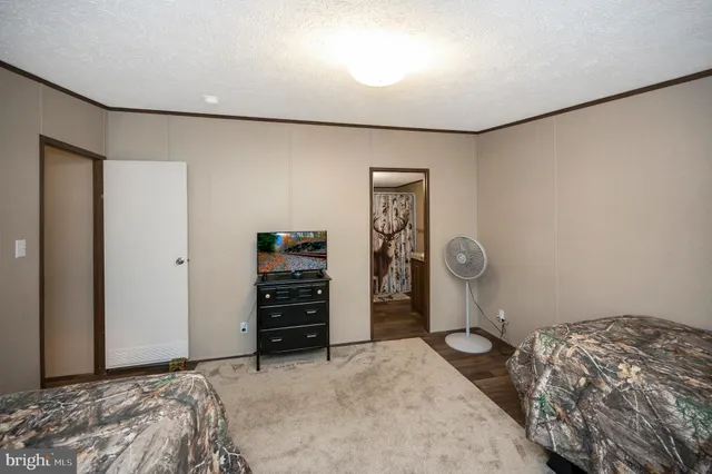 a bedroom with a bed and a walk in closet