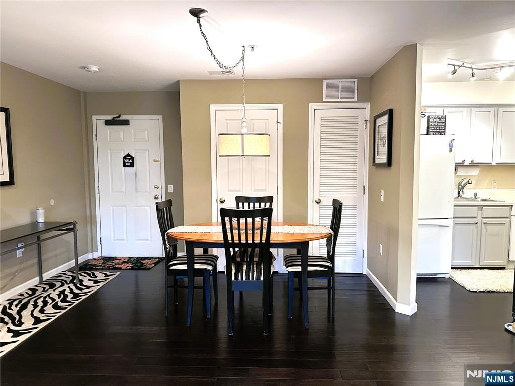 39 Union Street, Unit 105 Hackensack, NJ 07601 - Photo 6 of 22 a view of a dining room with furniture window and wooden floor