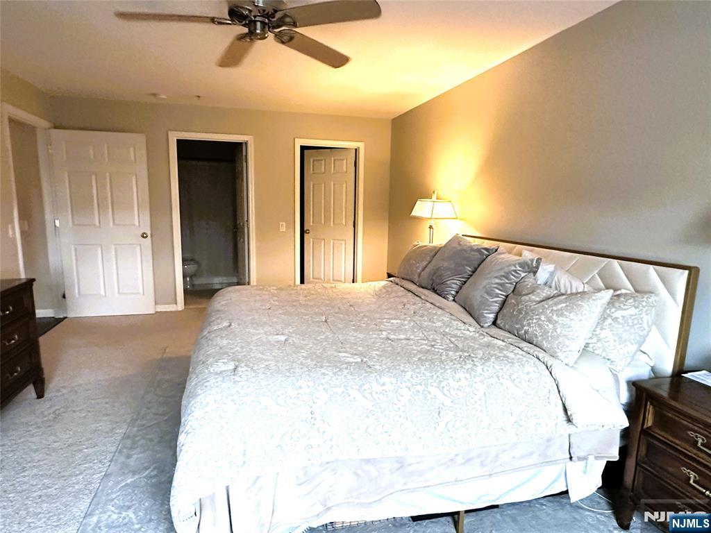 39 Union Street, Unit 105 Hackensack, NJ 07601 - Photo 10 of 22 a spacious bedroom with a bed and a cabinets