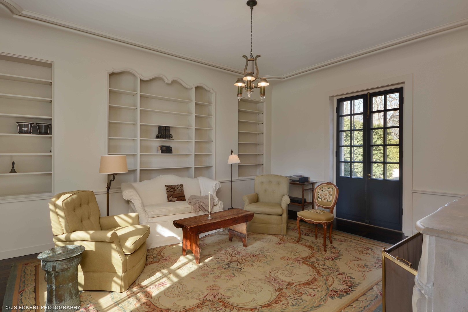 111 Moffett Road Lake Bluff, IL 60044 - Photo 16 of 51 a living room with furniture and a chandelier
