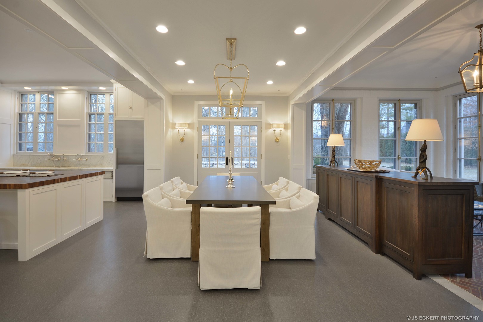 111 Moffett Road Lake Bluff, IL 60044 - Photo 18 of 51 a living room with couches and kitchen view with wooden floor