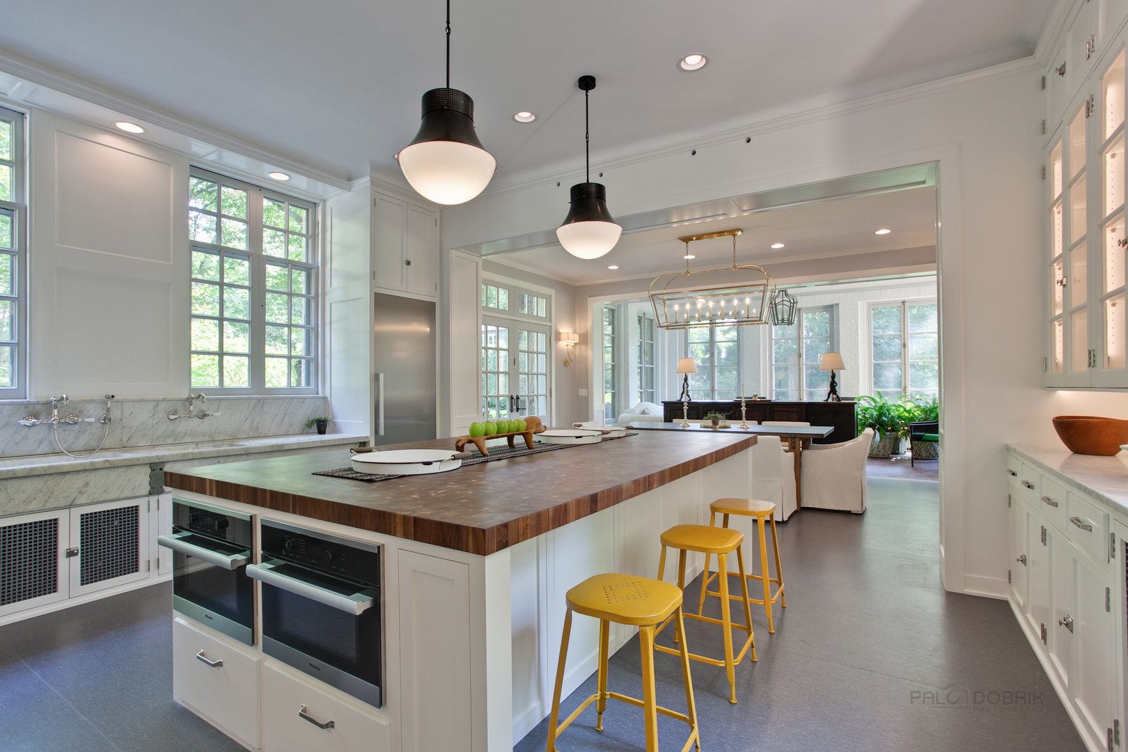 111 Moffett Road Lake Bluff, IL 60044 - Photo 21 of 51 a kitchen with a stove a sink a dining table and chairs