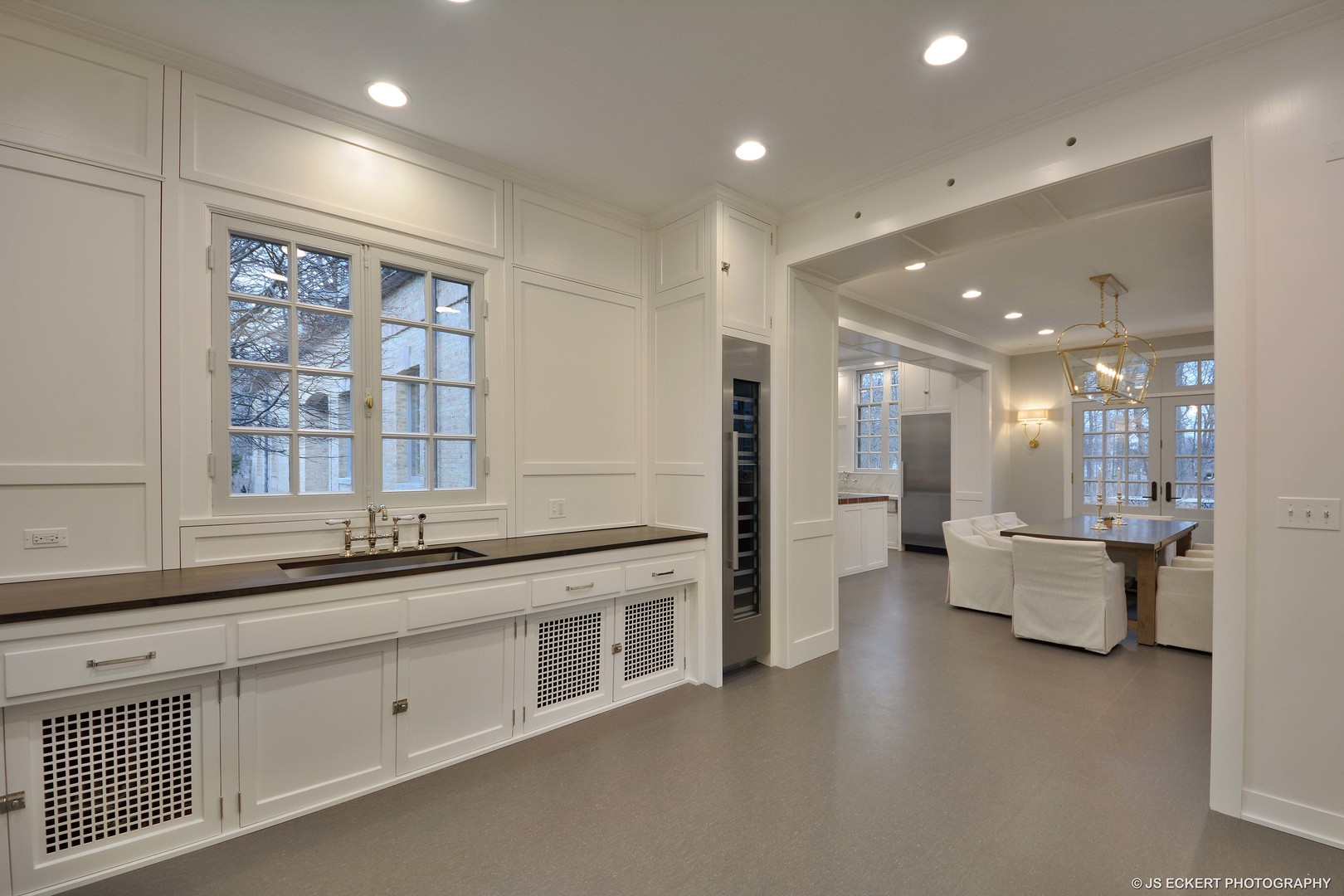 111 Moffett Road Lake Bluff, IL 60044 - Photo 27 of 51 a large white kitchen with a large window and stainless steel appliances