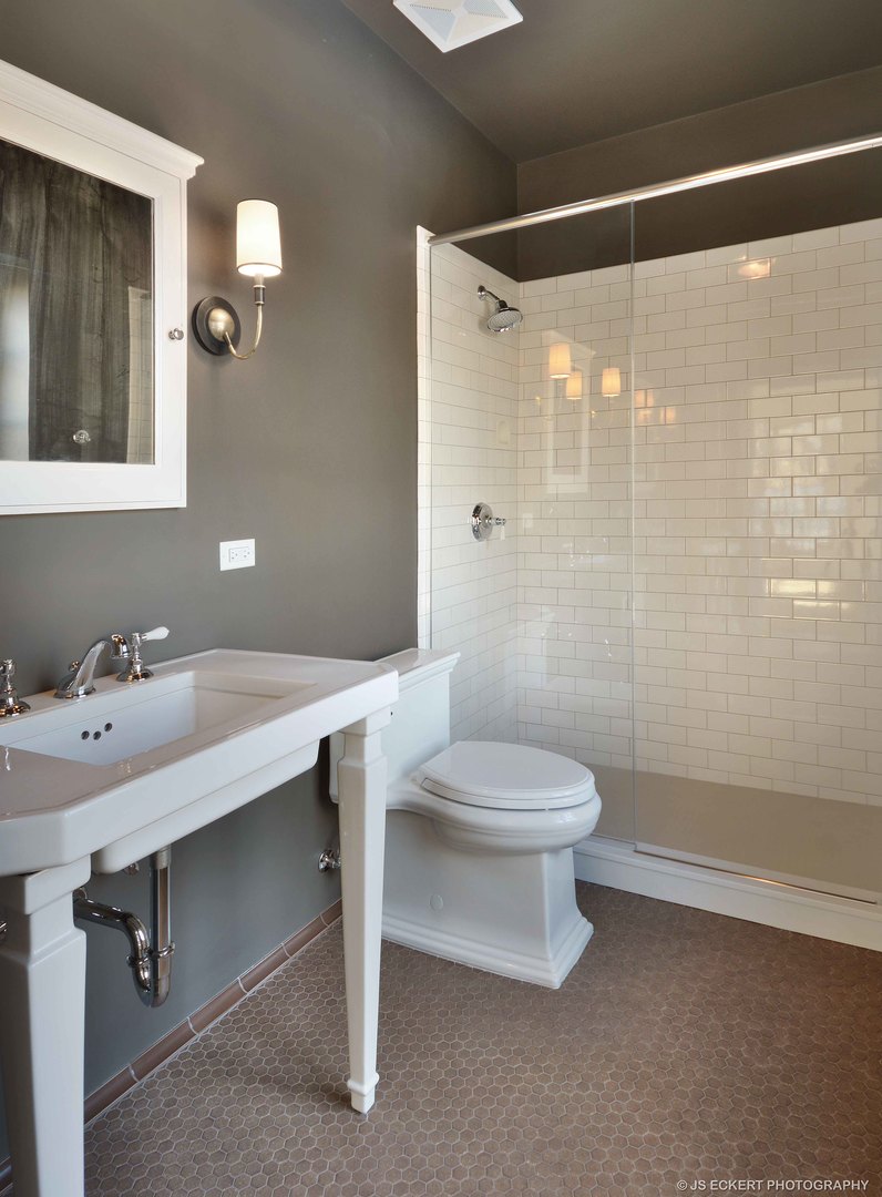 111 Moffett Road Lake Bluff, IL 60044 - Photo 39 of 51 a bathroom with a sink a toilet and shower