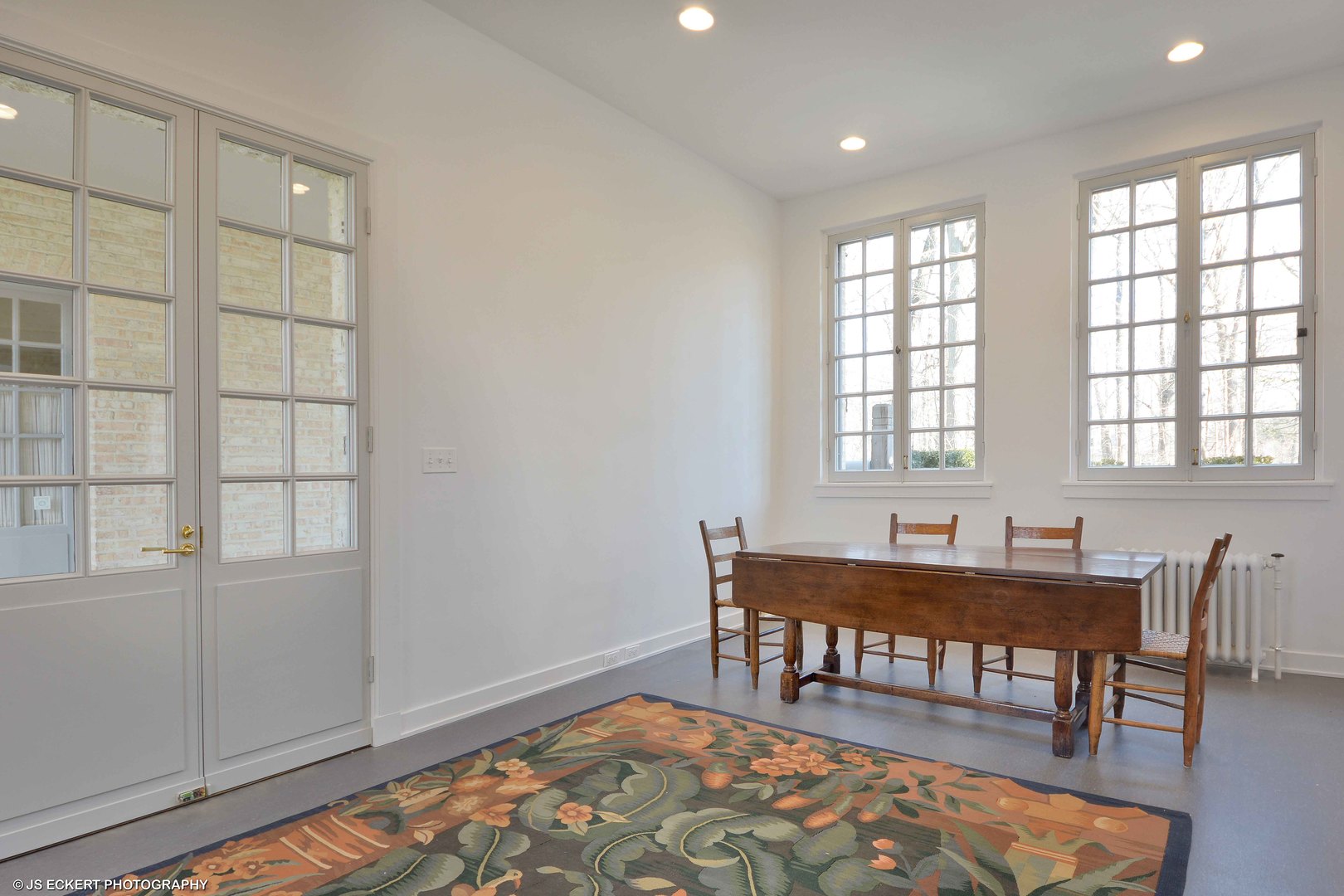 111 Moffett Road Lake Bluff, IL 60044 - Photo 41 of 51 a dining room with wooden floor and a chandelier