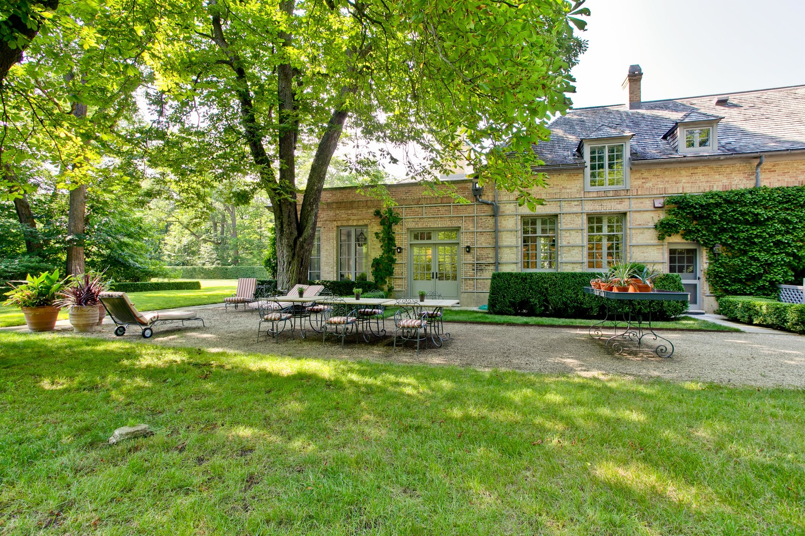 111 Moffett Road Lake Bluff, IL 60044 - Photo 46 of 51 a view of a patio with a table and chairs under an umbrella