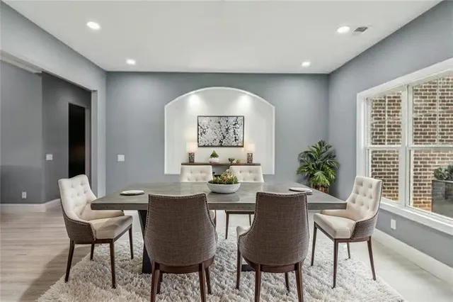 a view of a dining room with furniture window and outside view