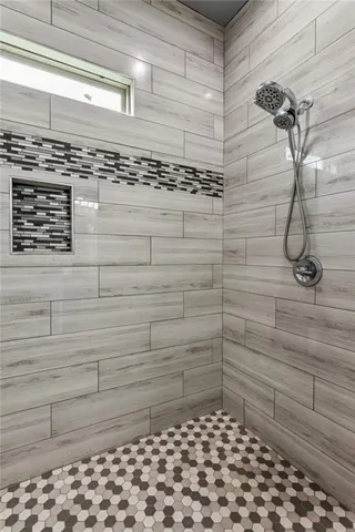 a bathroom with a sink and a shower