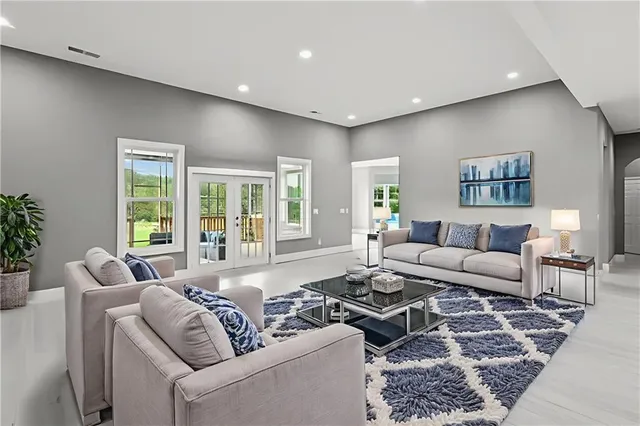 a living room with furniture and a large window