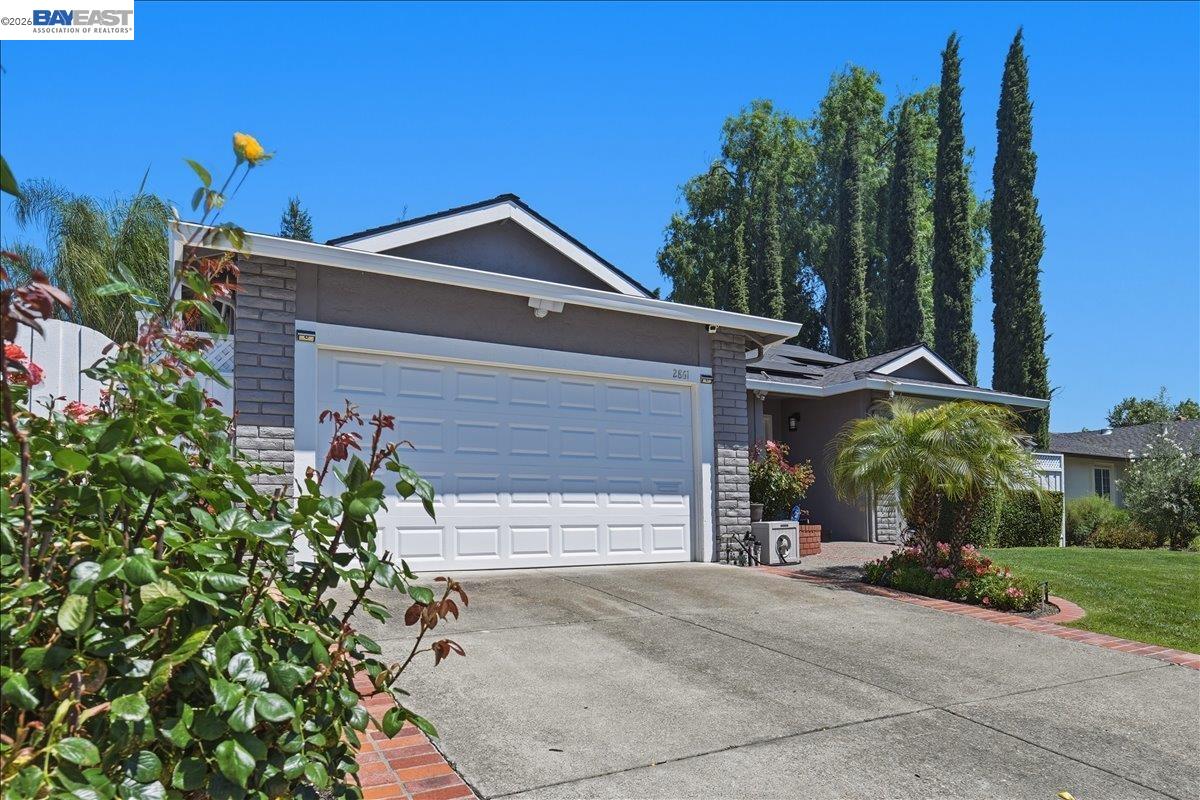 2861 Millbridge Place San Ramon, CA 94583 - Photo 5 of 58 a front view of a house with a yard