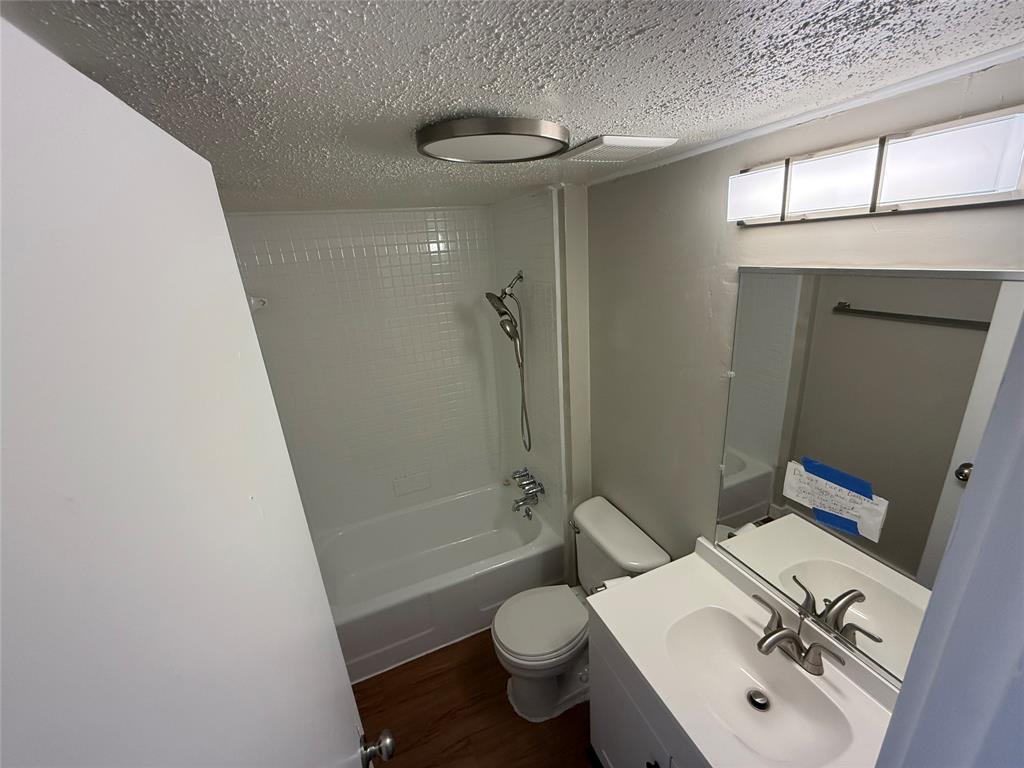 2408 Longview Street, Unit 108 Austin, TX 78705 - Photo 7 of 7 a bathroom with a sink a toilet and shower