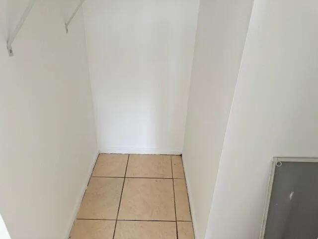 a kitchen with a sink a stove and cabinets