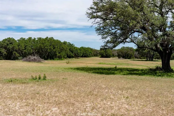 a view of a lake with houses in the back