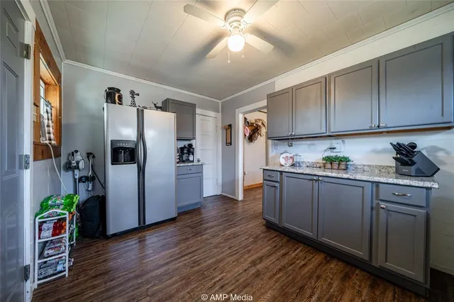 a kitchen with stainless steel appliances a stove microwave and cabinets