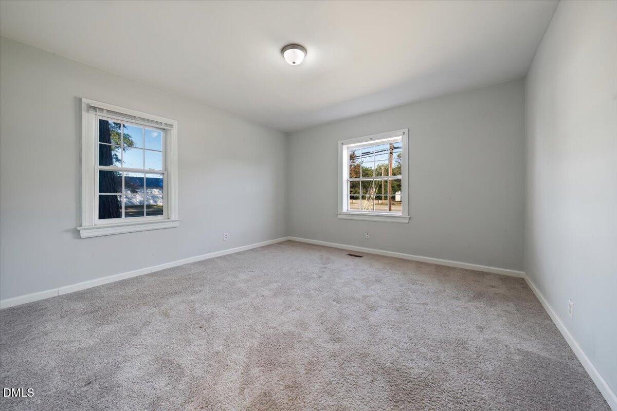 1213 Tarboro Street Southwest Wilson, NC 27893 - Photo 12 of 27 an empty room with a window