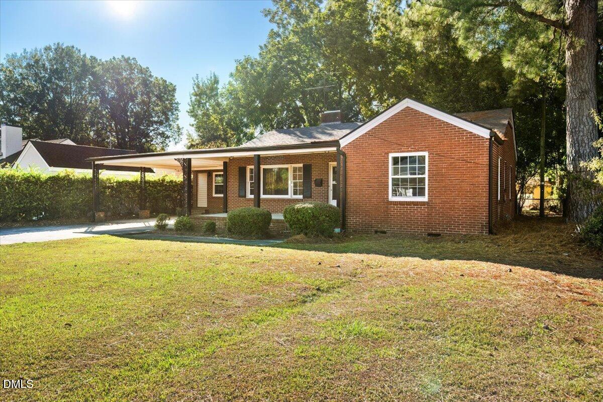 1213 Tarboro Street Southwest Wilson, NC 27893 - Photo 2 of 27 a front view of a house with yard