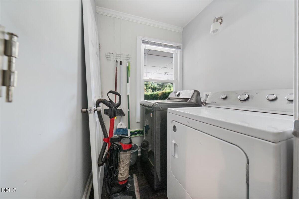 1213 Tarboro Street Southwest Wilson, NC 27893 - Photo 23 of 27 a view of storage and utility room with washer and dryer