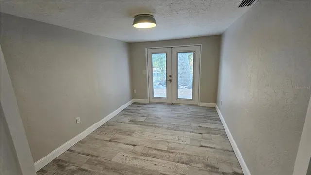 a view of backyard with outdoor seating and green space