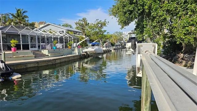 a view of empty room with wooden floor and fireplace