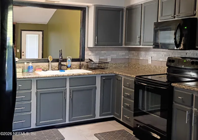 a bathroom with a toilet a sink and bathtub