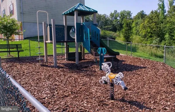 a backyard of a house with barbeque oven