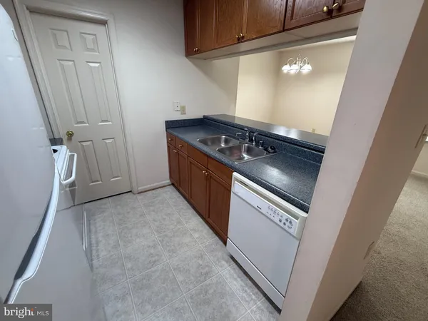 a view of a kitchen with a sink