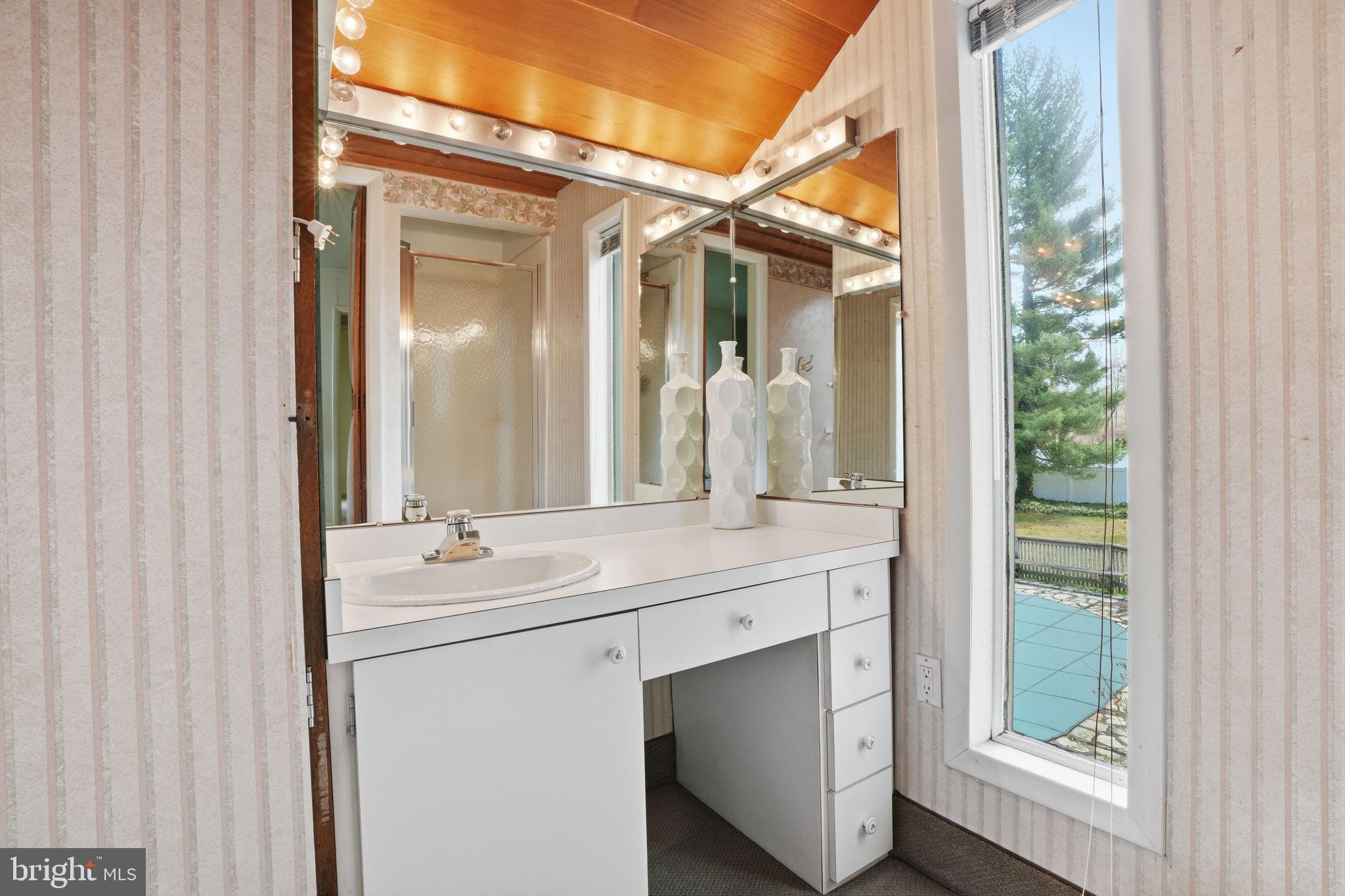 143 Pinehill Road Feasterville-Trevose, PA 19053 - Photo 21 of 43 a bathroom with a double vanity sink and a mirror