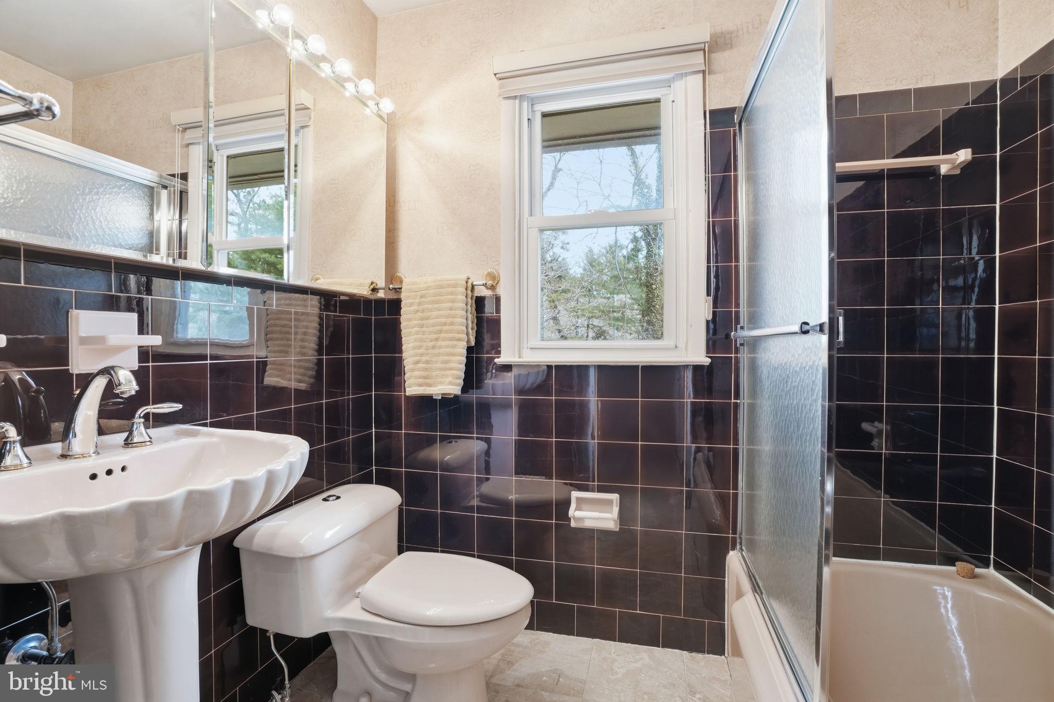 143 Pinehill Road Feasterville-Trevose, PA 19053 - Photo 23 of 43 a bathroom with a sink a toilet and shower