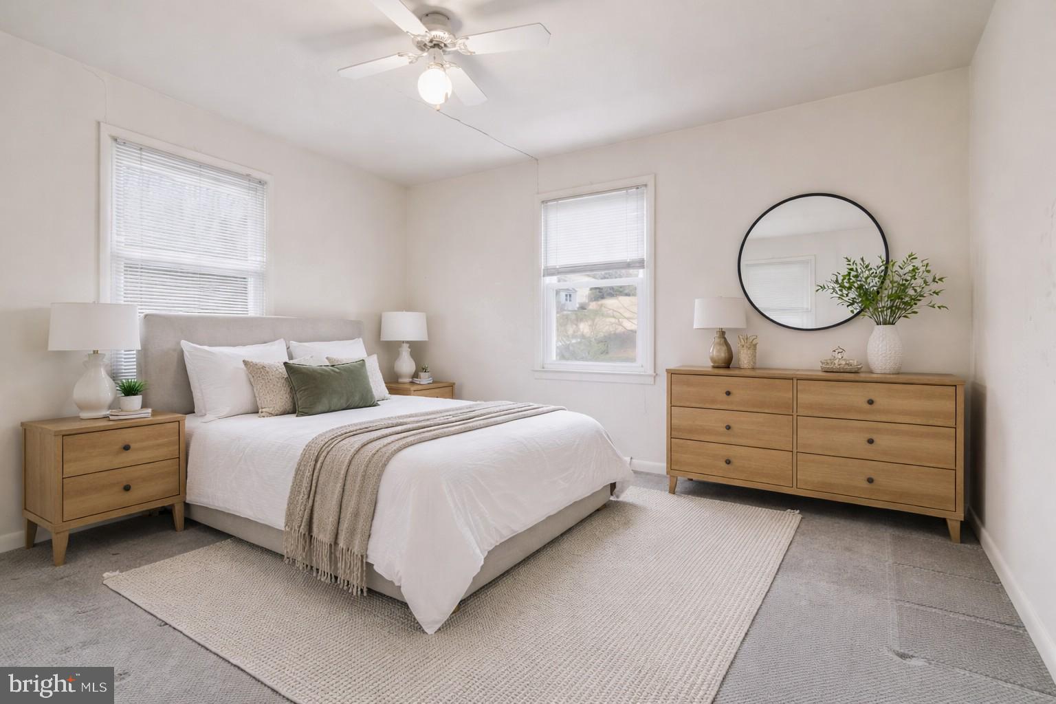 143 Pinehill Road Feasterville-Trevose, PA 19053 - Photo 24 of 43 a bedroom with a bed and a chandelier