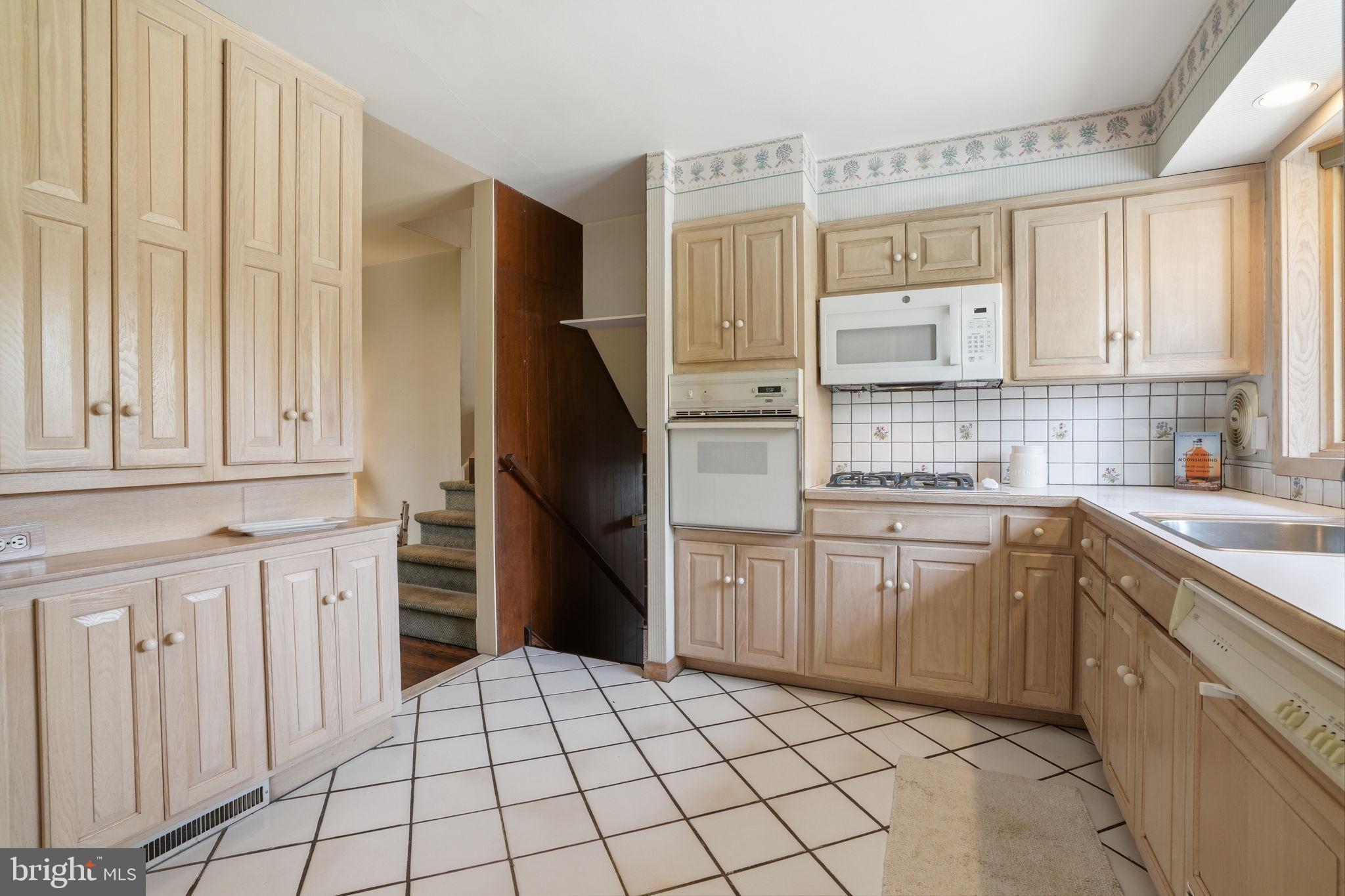 143 Pinehill Road Feasterville-Trevose, PA 19053 - Photo 4 of 43 a kitchen with stainless steel appliances a refrigerator sink and cabinets