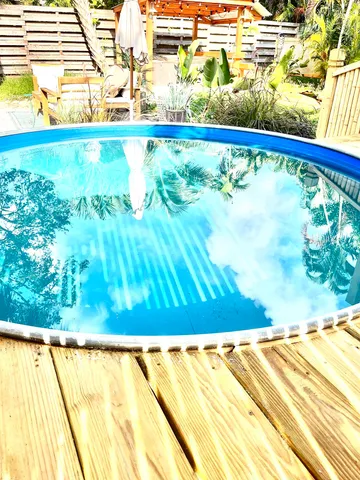 a view of swimming pool with a yard