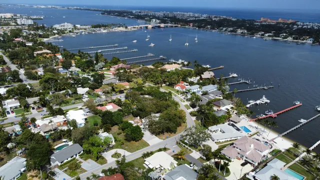 an aerial view of a house with lots of residential buildings