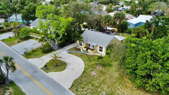 an aerial view of a house with a swimming pool