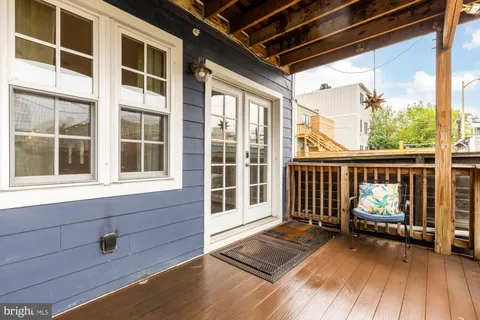 a view of balcony with wooden floor