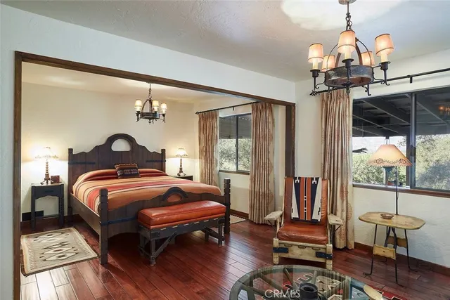 a bedroom with bed and a window