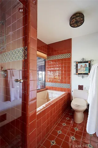 a bathroom with a sink a toilet and bathtub