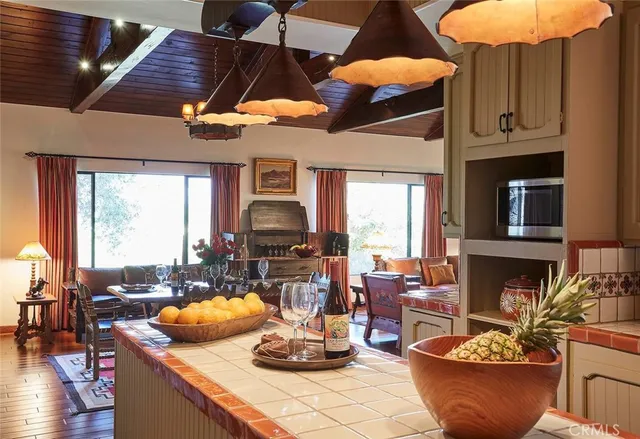 a kitchen with a table and chairs