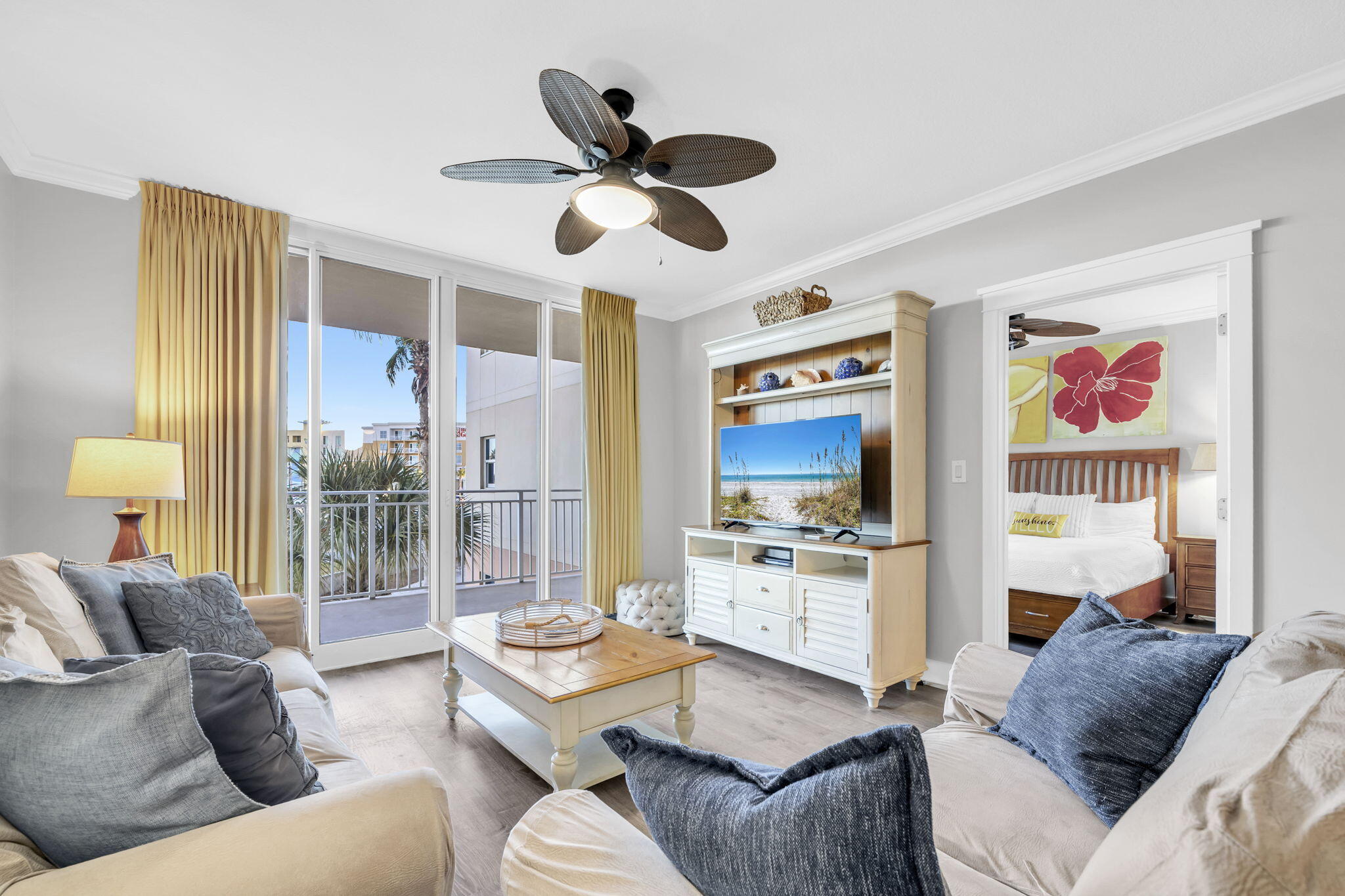 1110 Santa Rosa Boulevard, Unit A231 Fort Walton Beach, FL 32548 - Photo 13 of 59 a living room with furniture ceiling fan and a wooden floor