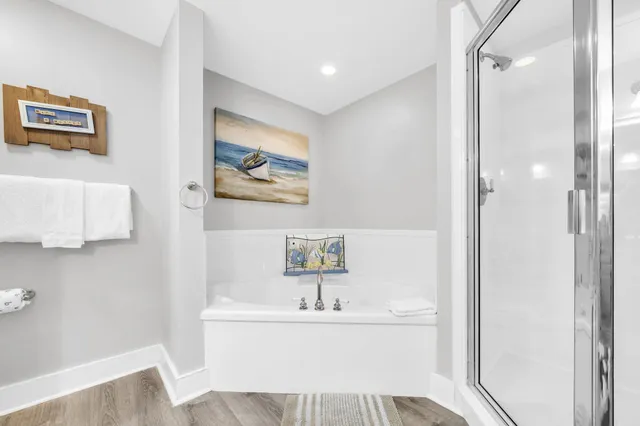 a bathroom with a shower and a sink