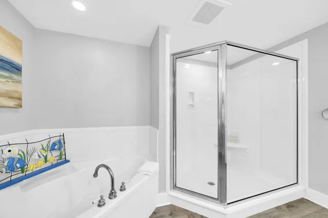 a bathroom with a glass shower door