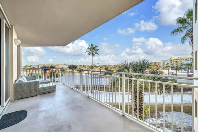 a view of a chairs and table in the patio