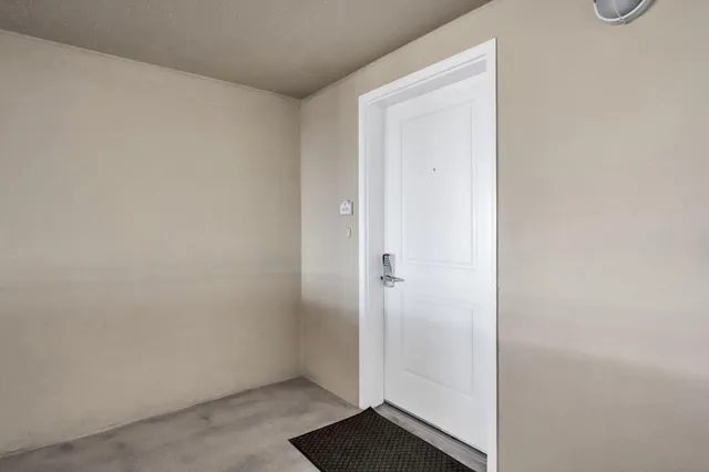 a view of city with tall buildings and a park